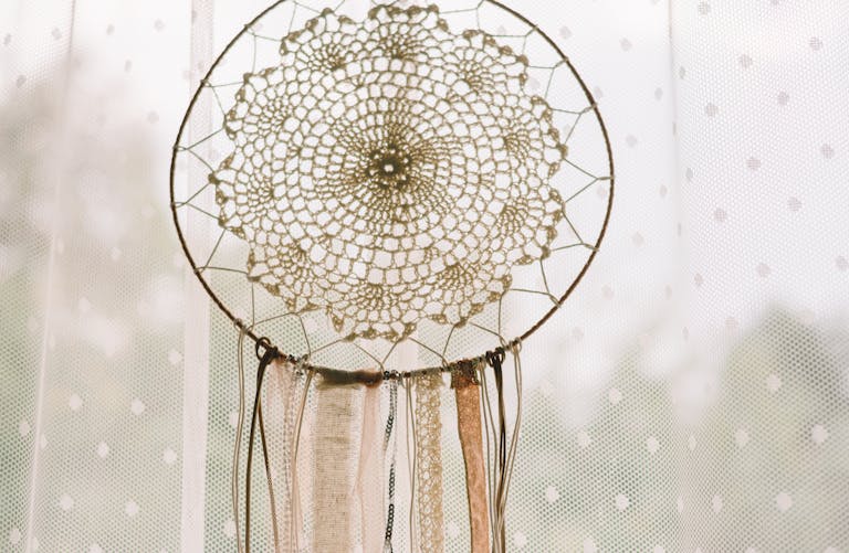 Close Up Photo of Hanging Woven Dreamcatcher