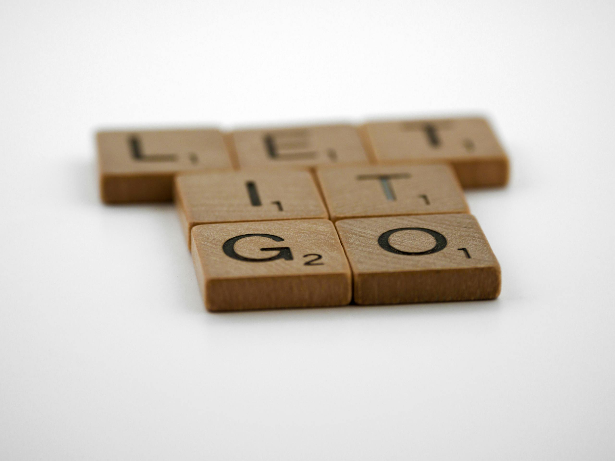 Scrabble Tiles on a White Surface