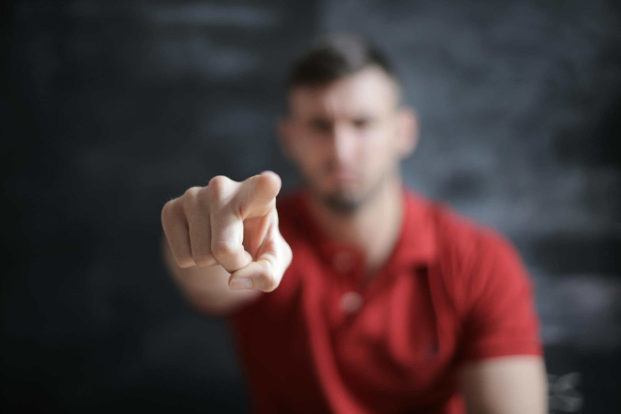 Selective Focus Photo of Man's Index Finger